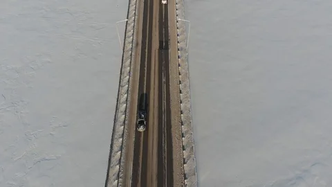 Long bridge over the frozen river Stock Footage 101577418