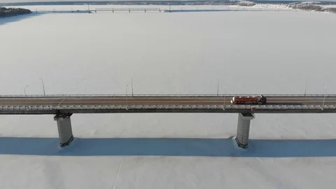 Long bridge over the frozen river Stock Footage 101577652