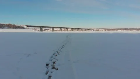 Long bridge over the frozen river Stock Footage 101577774