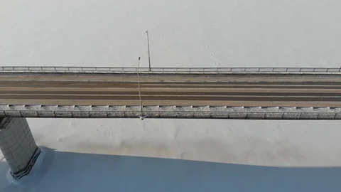 Long bridge over the frozen river Stock Footage 101577790