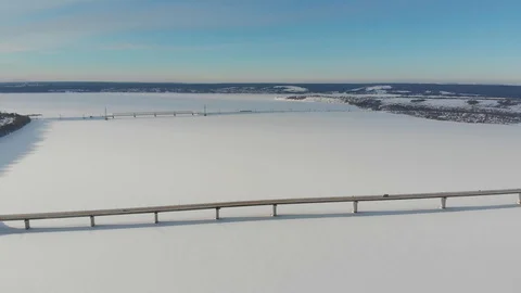Long bridge over the frozen river Stock Footage 101578237