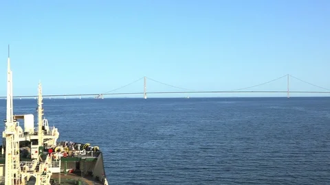 Long bridge silhouette over endless river under blue sky Stock Footage 113815487