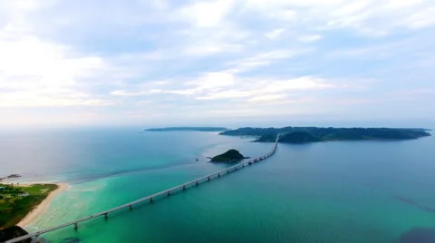 Long bridge spanning over blue ocean Stock Footage 67415512