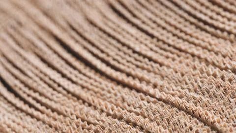 A long brown strip of thin sheets of kraft paper with line pattern. texture i Stock Photos