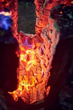 Long burning fire from a single log Stock Photos