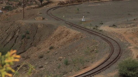 Long camp Man crosses the tracks, Eritrea Stock Footage 92193991