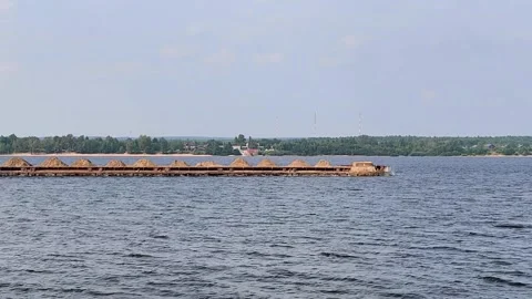 Long cargo barge navigating a large river or lake Stock Footage 317288533