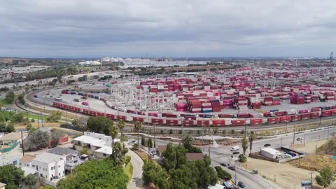 Long cargo train traveling through busy Port of Los Angeles container terminal s Stock Footage 336635044