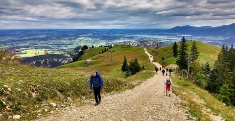 Long climb in the mountains next to a cable car. Tannheimer Tal, austria Stock Photos