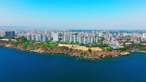 Long coastline backed by a continuous skyline of high-rise residential towers Stock Footage 334212300