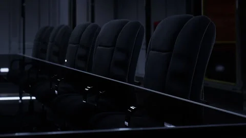 Long conference table with empty black chairs in modern office setting 動画素材 345003077