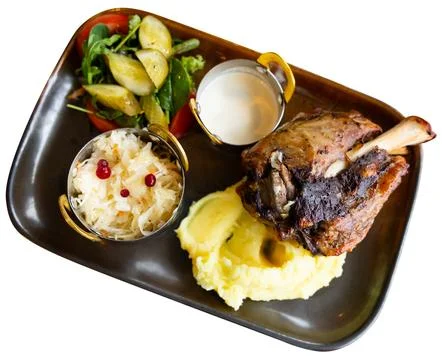 Long cooked meat served with mashed potatoes, cabbage and sauce Stock Photos