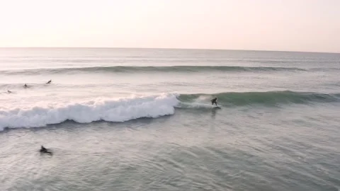 Long Cornish waves, where three surfers surf the same wave Stock Footage 143243632