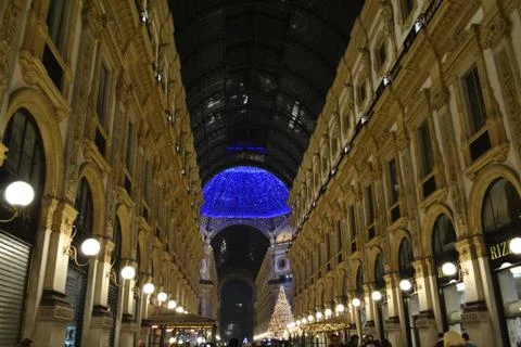 Long corridor to central square decorated for Christmas in Milan shopping mall. Stock Photos