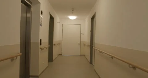 Long Corridor With Handrails and Doors, Residential Care Building, Forward Move 動画素材 340360541