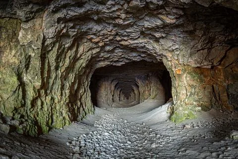 A long corridor inside the cave Stock Photos