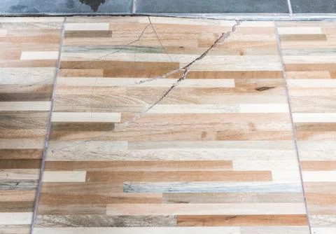 Long crack on the  wooden pattern tile. Stock Photos