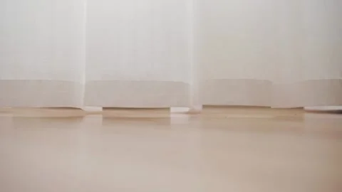 Long curtains to the floor by the window 動画素材 147174237