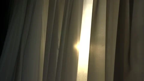 Long curtains of grey colour waved by wind against sunlight Stock Footage 156789701
