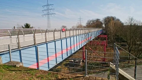 Long cycle tack bridge passing valley Video stock 73565948