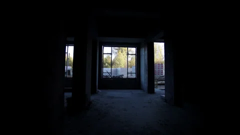Long dark corridor inside incomplete apartment building Stockbeeldmateriaal 330991610
