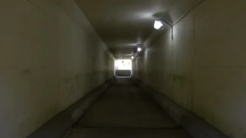 Long dark tunnel with low light Stock Footage 335388289