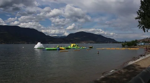 Long Distance Shot of Clouds over Inflatable Water Park Stock Footage 52306906