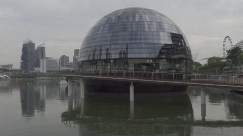 Long dolly shot forward to apple store float marina bay singapore Stock Footage 139342487