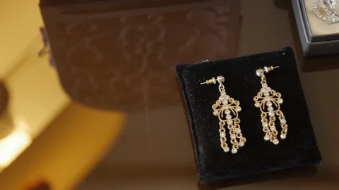 Long Earrings in a Gift box on the Table. Bijouterie Stock Footage 123514188