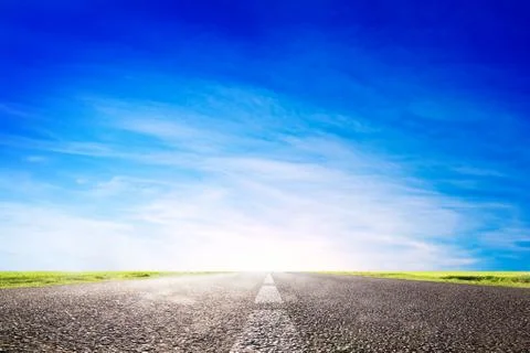 Long empty asphalt road, highway towards sun. travel, transport concepts Stock Photos