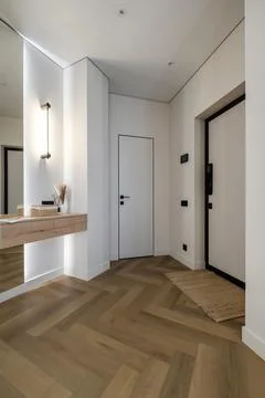 Long empty corridor in interior of entrance hall of modern apartments, office Stock Photos