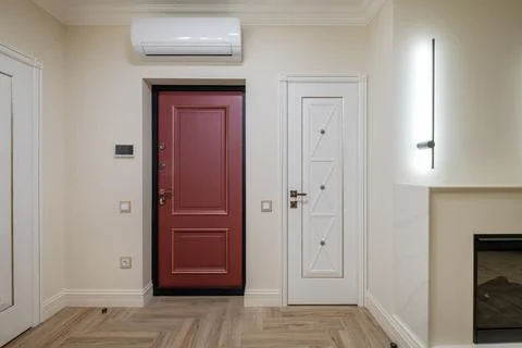 Long empty corridor in interior of entrance hall of modern apartments, office Stock Photos
