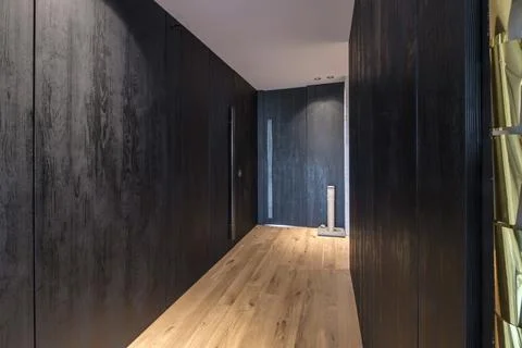 Long empty corridor in interior of entrance hall of modern apartments, office Stock Photos