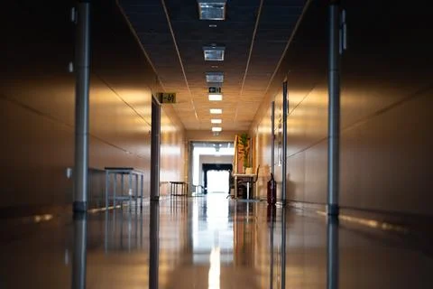 Long empty corridor in a modern building with a shiny floor Фото