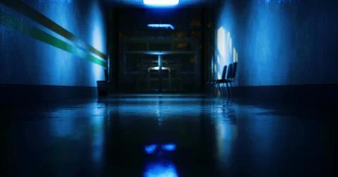 Long empty hallway with blue lighting and reflections on the wet floor Ilustración de archivo
