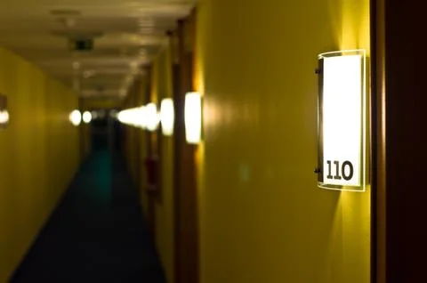 Long empty hotel corridor Stock Photos