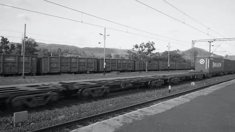 Long Empty Indian railways freight goods industrial train moving Mumbai India BW Stock Footage 135467683