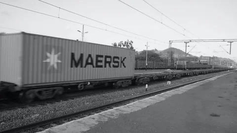 Long Empty Indian railways freight goods industrial train moving Mumbai India BW Video stock 135467690