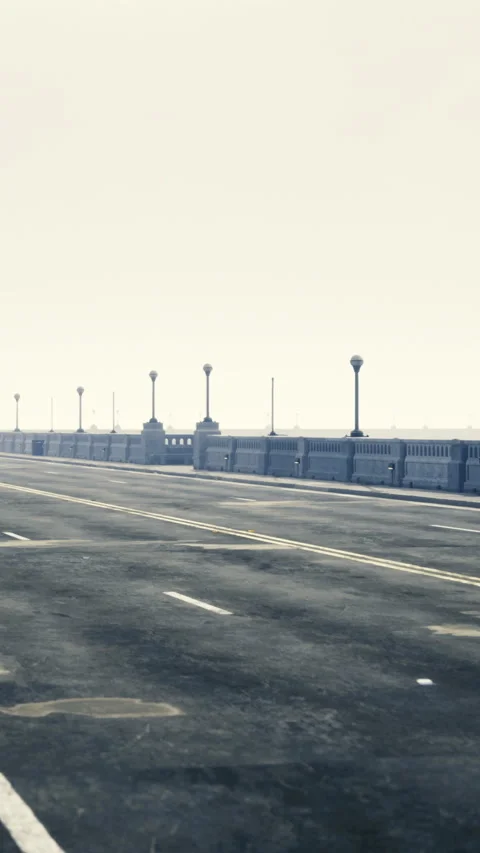 Long empty road leading to the horizon in a foggy coastal setting Vídeos de archivo 326147524