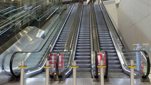 Long empty running upward escalators in airport terminal Stock Footage 161286933