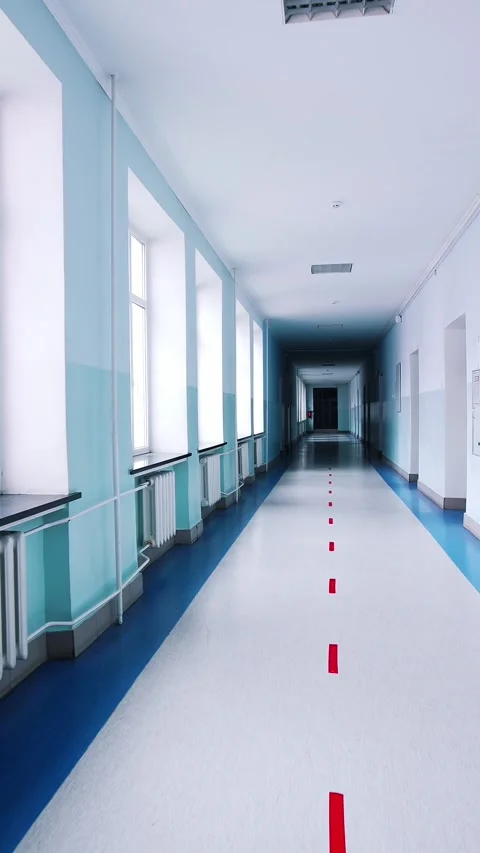 Long empty school hallway perspective view with red line markers on floor a.. Stock Footage 337545132