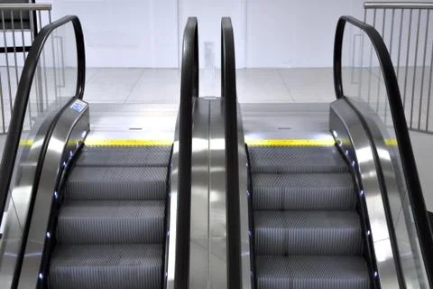 Long escalators in shopping centre Stock Photos