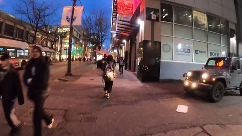 Long evening time lapse walk up granville st Stock Footage 121126133