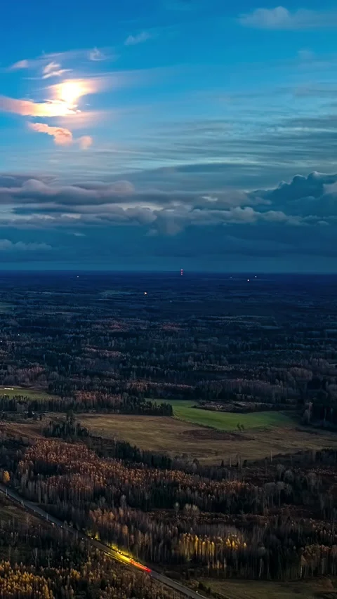 Long Exposure Aerial Vertical Timelapse of Moon Flowing Clouds and Car Light Stock Footage 335150634