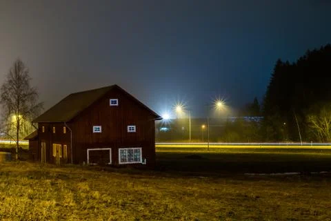 A long exposure with a barn at night Stock Photos