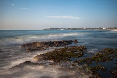 Long exposure capture with beach, reef and rocks.. Stock Photos