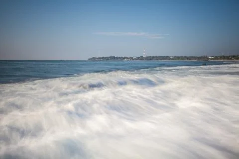 Long exposure capture with beach, reef and rocks.. Stock Photos