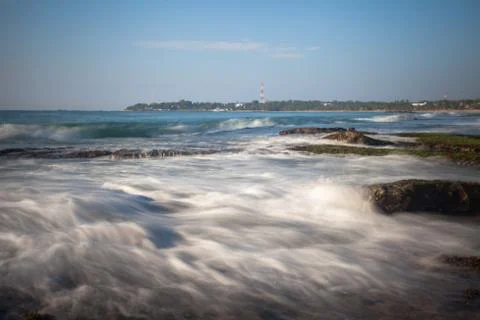 Long exposure capture with beach, reef and rocks.. Stock-Fotos