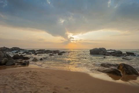 Long exposure capture with beach, reef and rocks.. Stock Photos