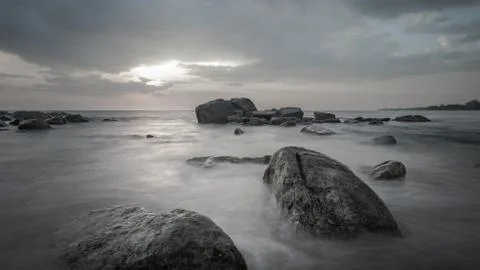 Long exposure capture with beach, reef and rocks.. Stock Photos